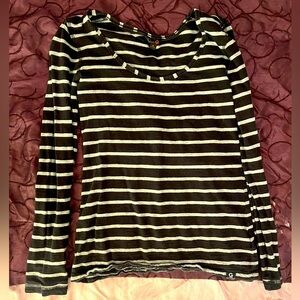 Two G by Guess shirts. Multicolored. Multiple sizes. Medium wear.